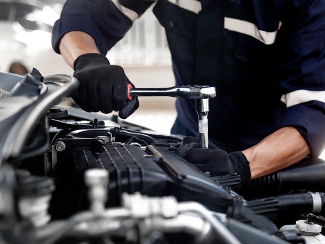Technician Servicing the Vehicle